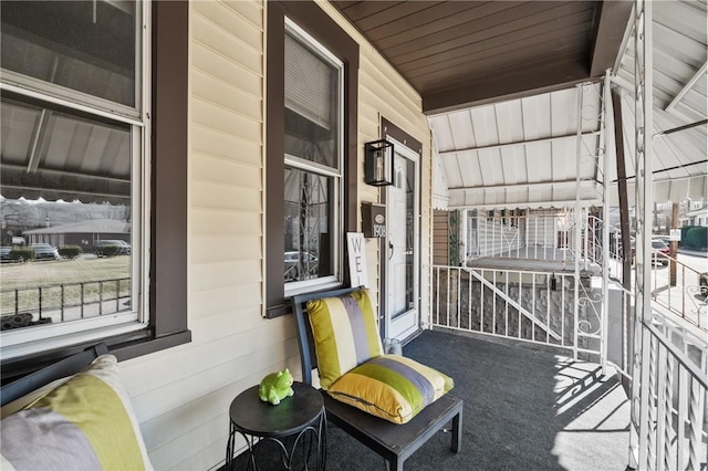 view of patio / terrace featuring covered porch and a balcony