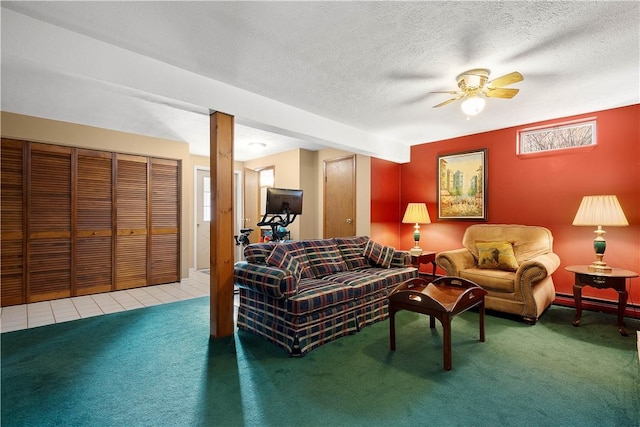 tiled living room featuring a baseboard radiator, carpet floors, a textured ceiling, and ceiling fan