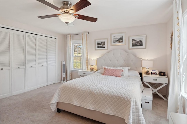 bedroom with light colored carpet, a closet, and ceiling fan