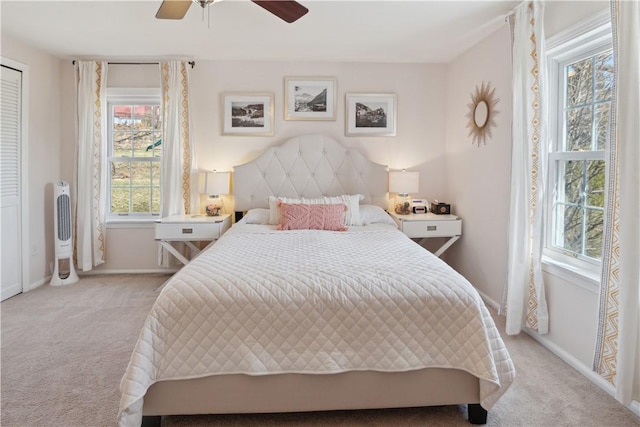 bedroom with baseboards, light carpet, and ceiling fan