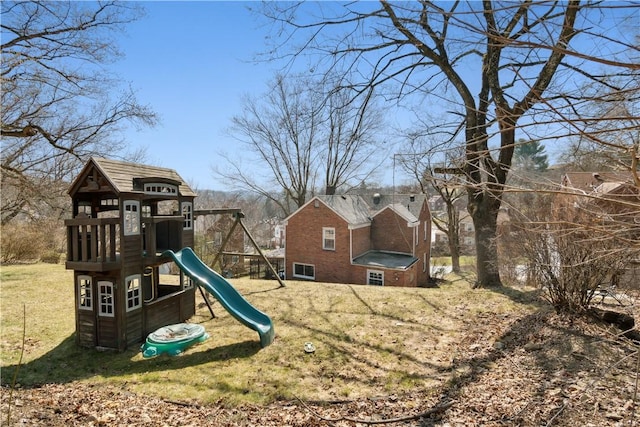 view of play area featuring a lawn