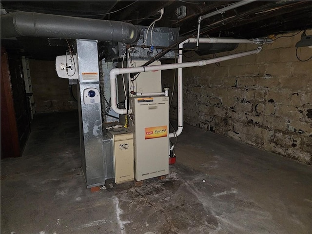 utility room featuring heating unit