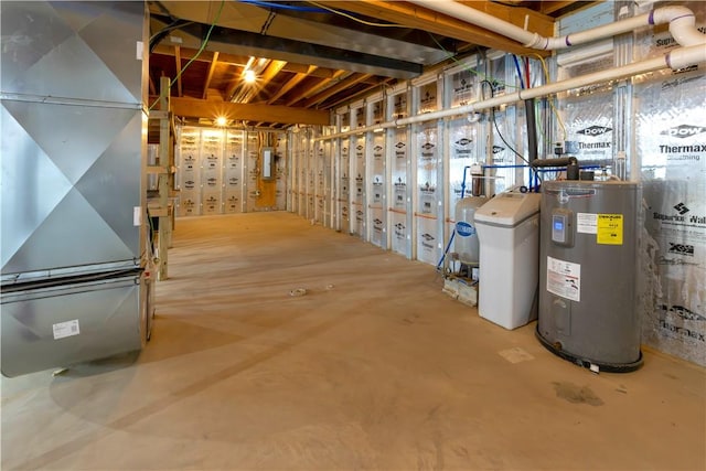 unfinished below grade area featuring electric panel and electric water heater