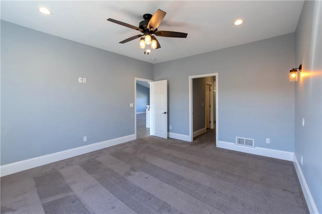 carpeted spare room featuring recessed lighting, visible vents, ceiling fan, and baseboards