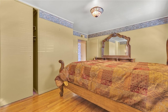 bedroom with wood finished floors