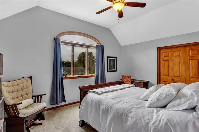 bedroom with carpet floors, baseboards, a ceiling fan, and vaulted ceiling