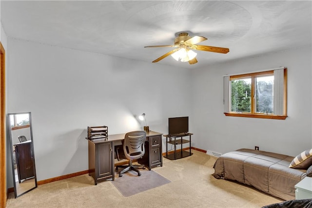 home office with light colored carpet, baseboards, and a ceiling fan