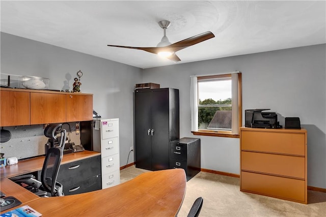 bedroom featuring light colored carpet, baseboards, and ceiling fan