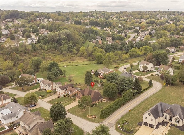 birds eye view of property with a residential view