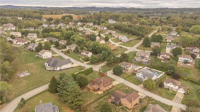 birds eye view of property with a residential view