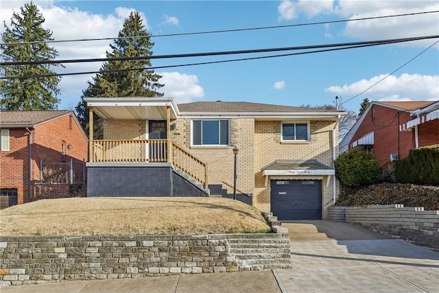 single story home featuring brick siding, stairway, an attached garage, and driveway