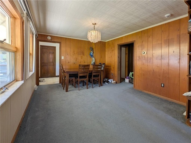 1602 Ross Hill Rd, Patterson Twp, PA 15010 - dining space featuring carpet flooring, a notable chandelier, ornamental molding, and wooden walls