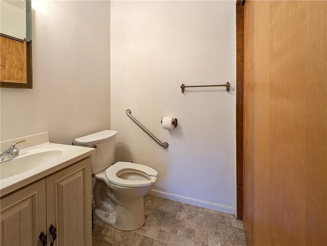 1602 Ross Hill Rd, Patterson Twp, PA 15010 - bathroom featuring toilet, vanity, and baseboards