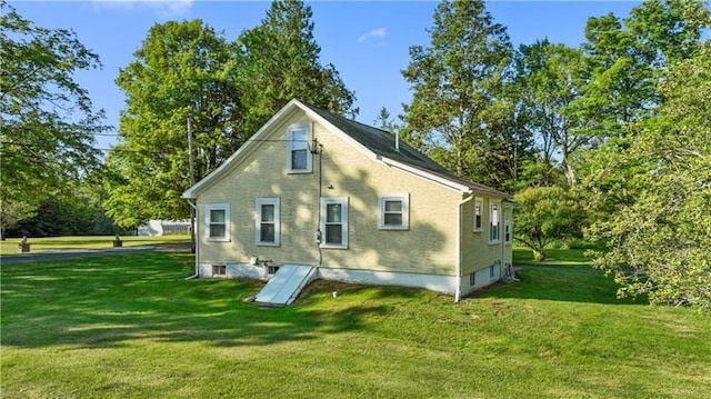 back of house with a yard