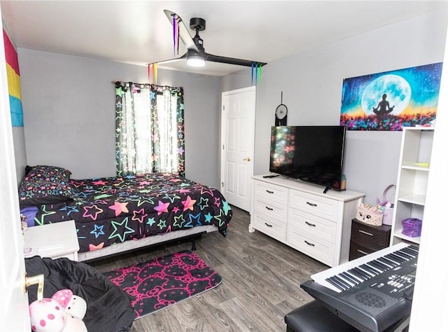 bedroom with wood finished floors