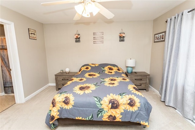 carpeted bedroom featuring a ceiling fan and baseboards