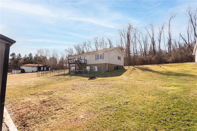 view of yard with stairway and fence