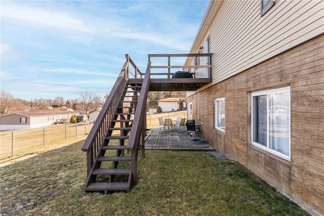 view of yard featuring a patio, stairway, and fence