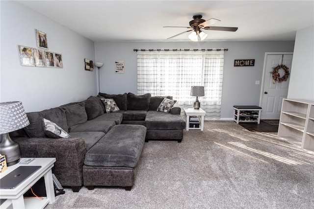 carpeted living room featuring a ceiling fan