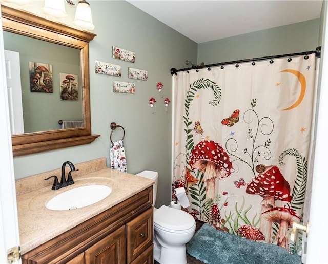 full bathroom with vanity, curtained shower, and toilet