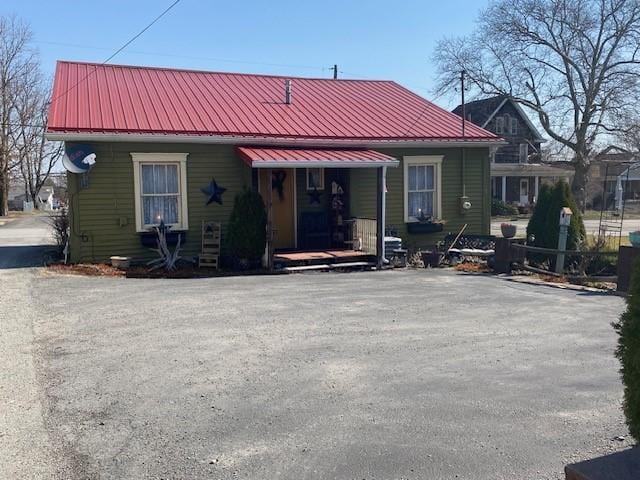 view of front of home with metal roof and covered porch