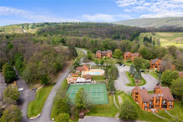 aerial view with a mountain view and a wooded view