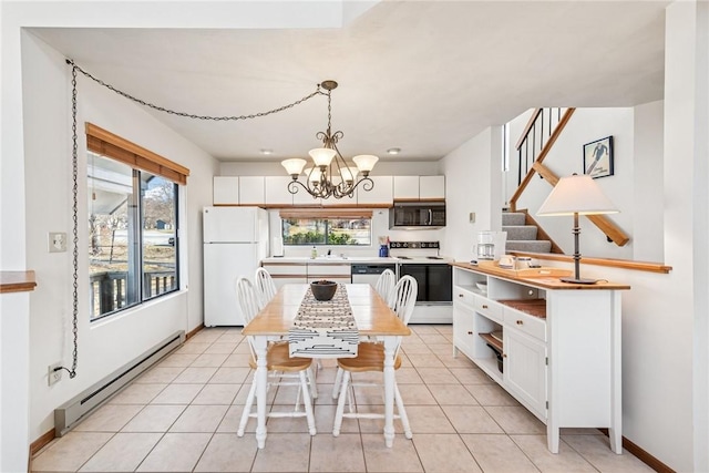 kitchen featuring a chandelier, white appliances, baseboard heating, and white cabinets