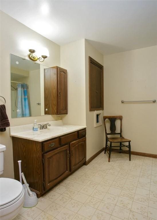 full bathroom with vanity, baseboards, curtained shower, tile patterned floors, and toilet