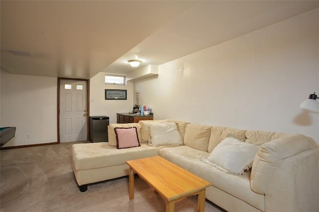 living area featuring baseboards and carpet floors