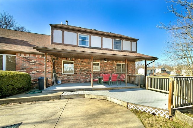 rear view of property featuring brick siding