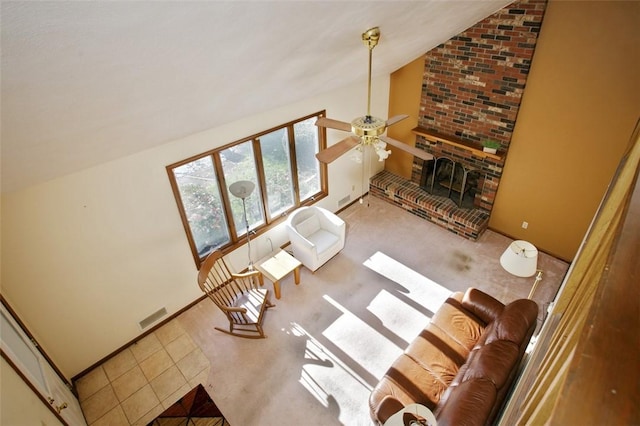 living room featuring visible vents, carpet floors, lofted ceiling, ceiling fan, and tile patterned flooring