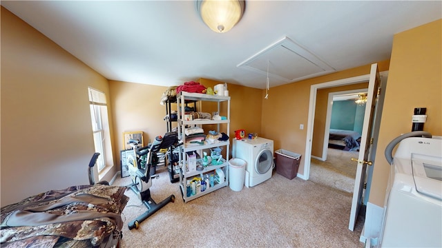 interior space featuring carpet flooring, washing machine and dryer, and baseboards