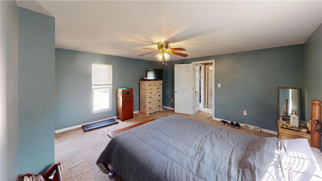 bedroom with a ceiling fan, baseboards, and light carpet