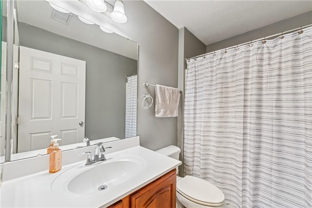 full bathroom with visible vents, toilet, and vanity