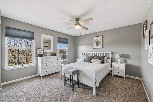 bedroom featuring baseboards, carpet floors, and a ceiling fan