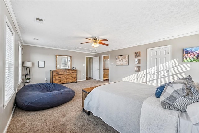 bedroom with visible vents, multiple windows, crown molding, and carpet floors