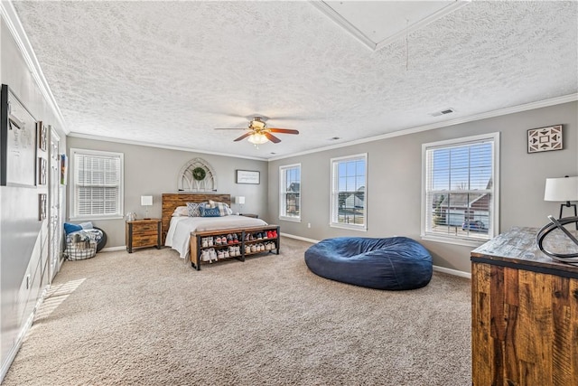 carpeted bedroom with attic access, multiple windows, and ornamental molding