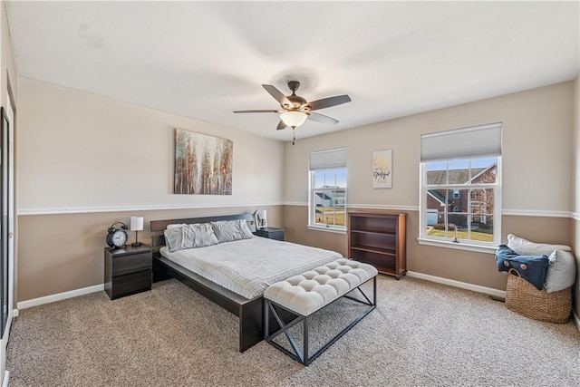 bedroom with carpet flooring, a ceiling fan, and baseboards