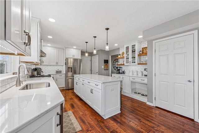 kitchen with white cabinetry, open shelves, stainless steel refrigerator with ice dispenser, and a sink