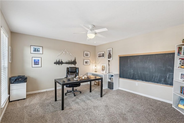 office space featuring a ceiling fan, carpet, and baseboards