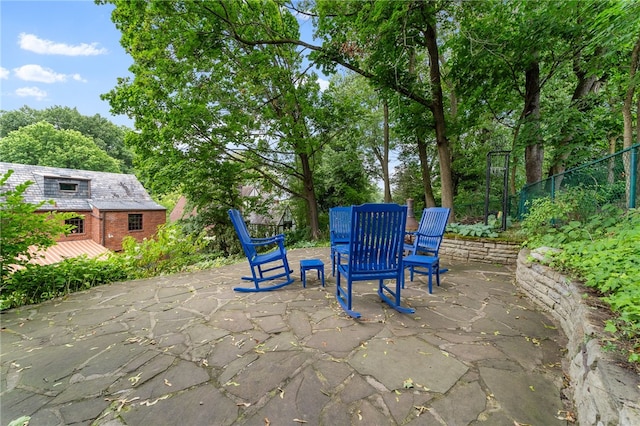 view of patio featuring fence