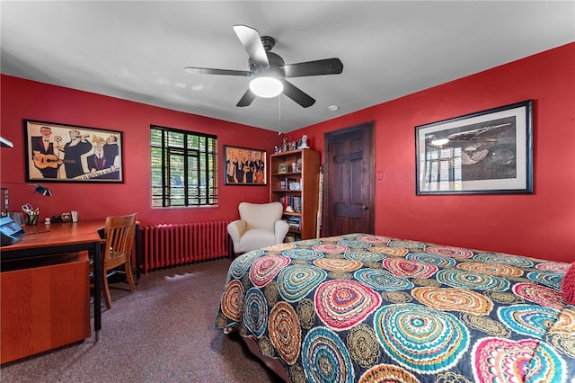 carpeted bedroom with radiator heating unit and ceiling fan