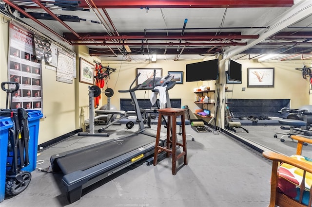 exercise room with a garage