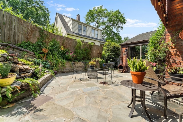 view of patio featuring fence