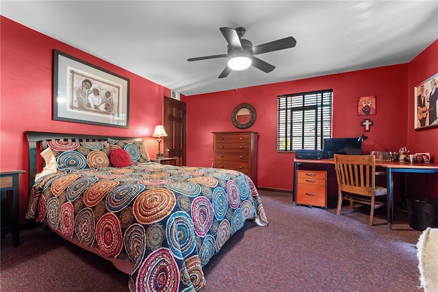 carpeted bedroom with visible vents, baseboards, and a ceiling fan