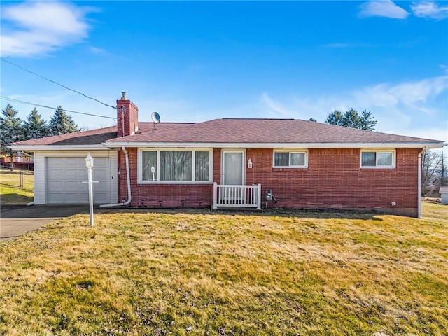 single story home featuring brick siding, an attached garage, a chimney, and a front yard