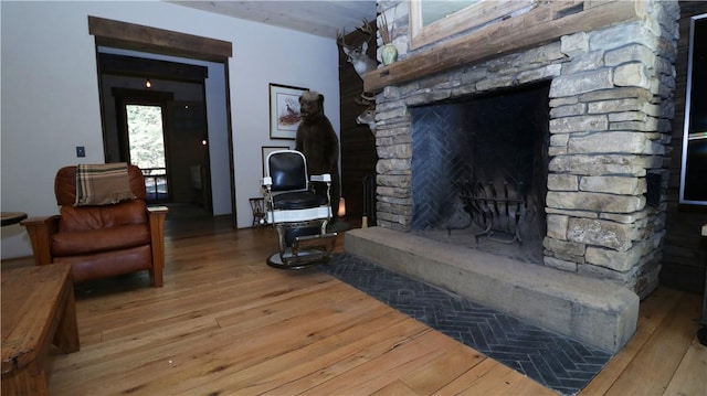 000 Wonder Ln, Punxsutawney Area School District, PA 15767 - living area featuring wood-type flooring and a stone fireplace
