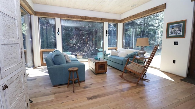 sunroom featuring a wealth of natural light and wood ceiling