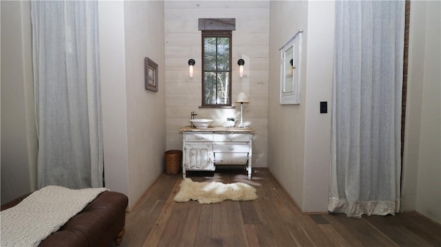 bathroom with hardwood / wood-style floors and vanity