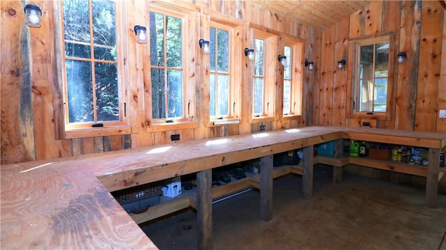 000 Wonder Ln, Punxsutawney Area School District, PA 15767 - unfurnished dining area with wooden walls, a relaxing sauna, and concrete flooring